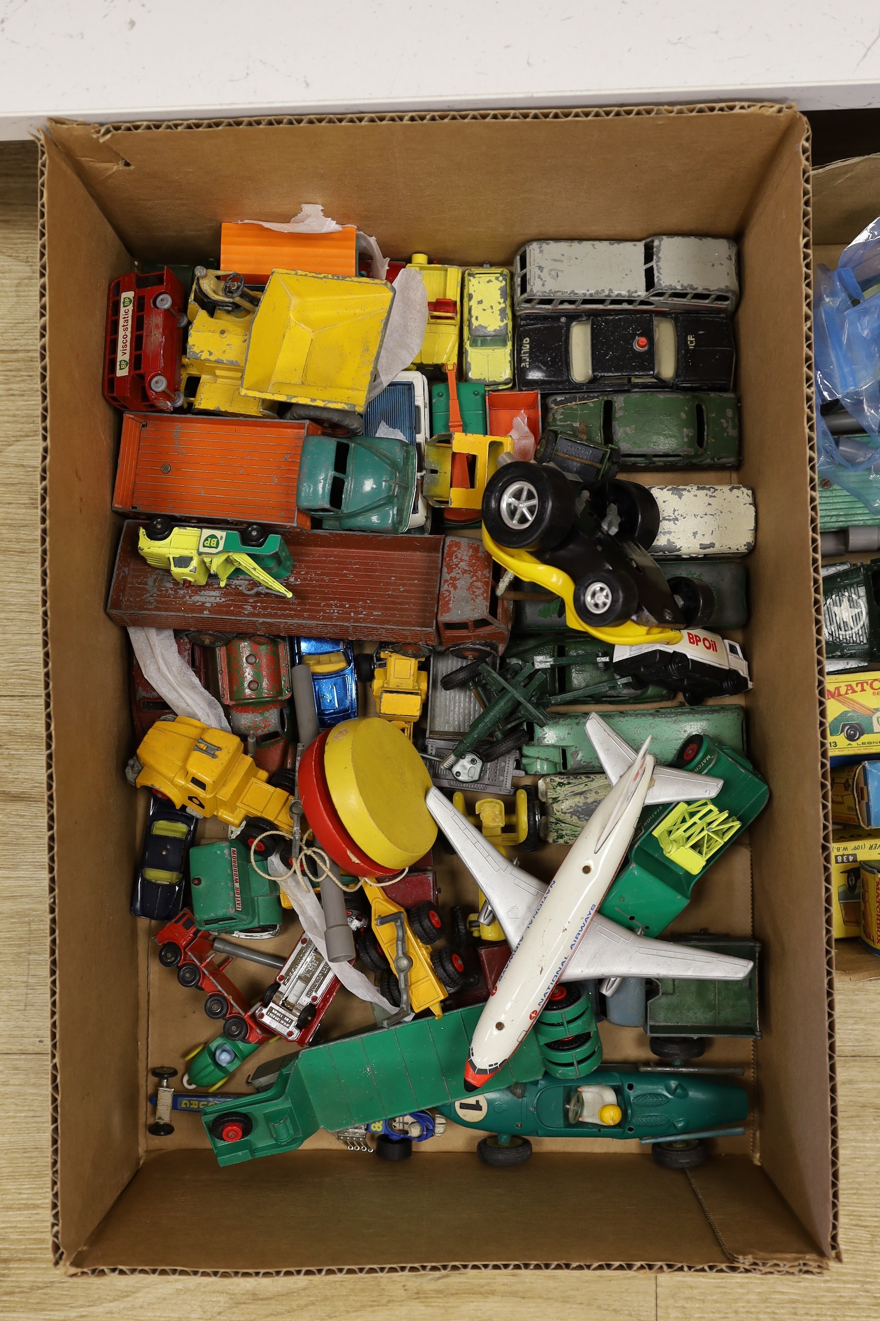 A collection of die-cast toys and boxed games